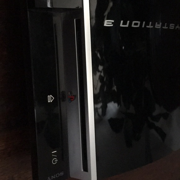 A PlayStation 3 and controller with all the cords. - Picture 4 of 6